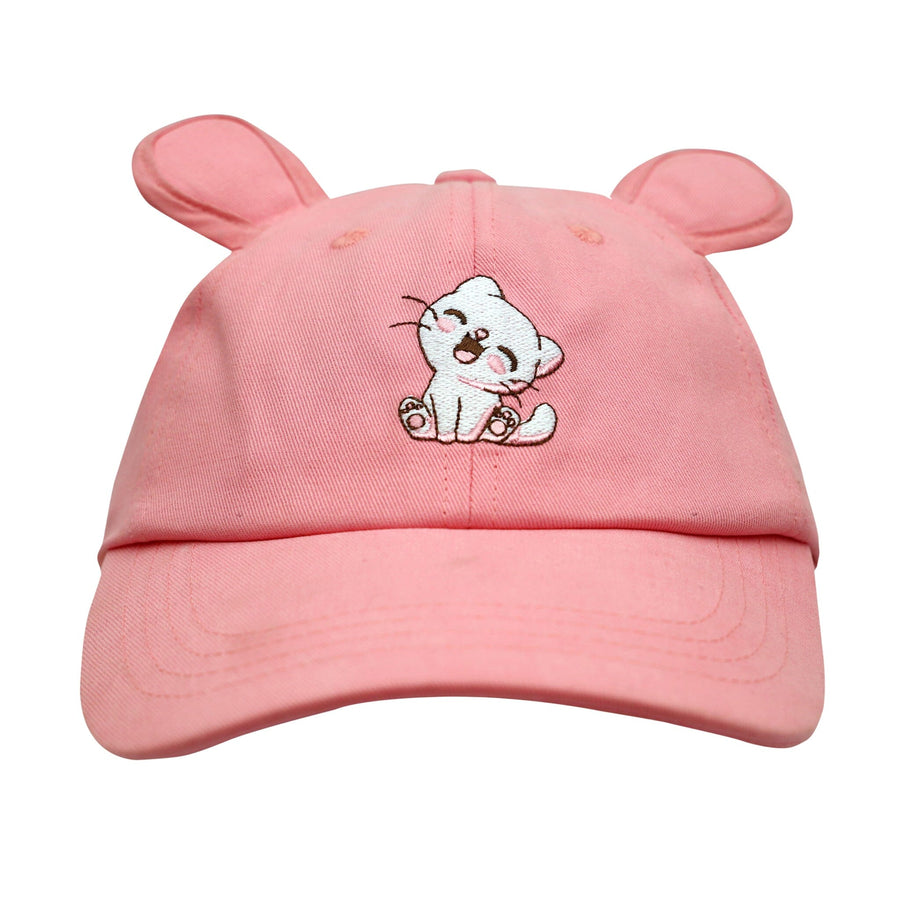 Pastel pink cotton baseball cap with two sewn-on pink cat ears on the top and a cute black and white cat embroidered on the front. The cap has an adjustable strap in the back.