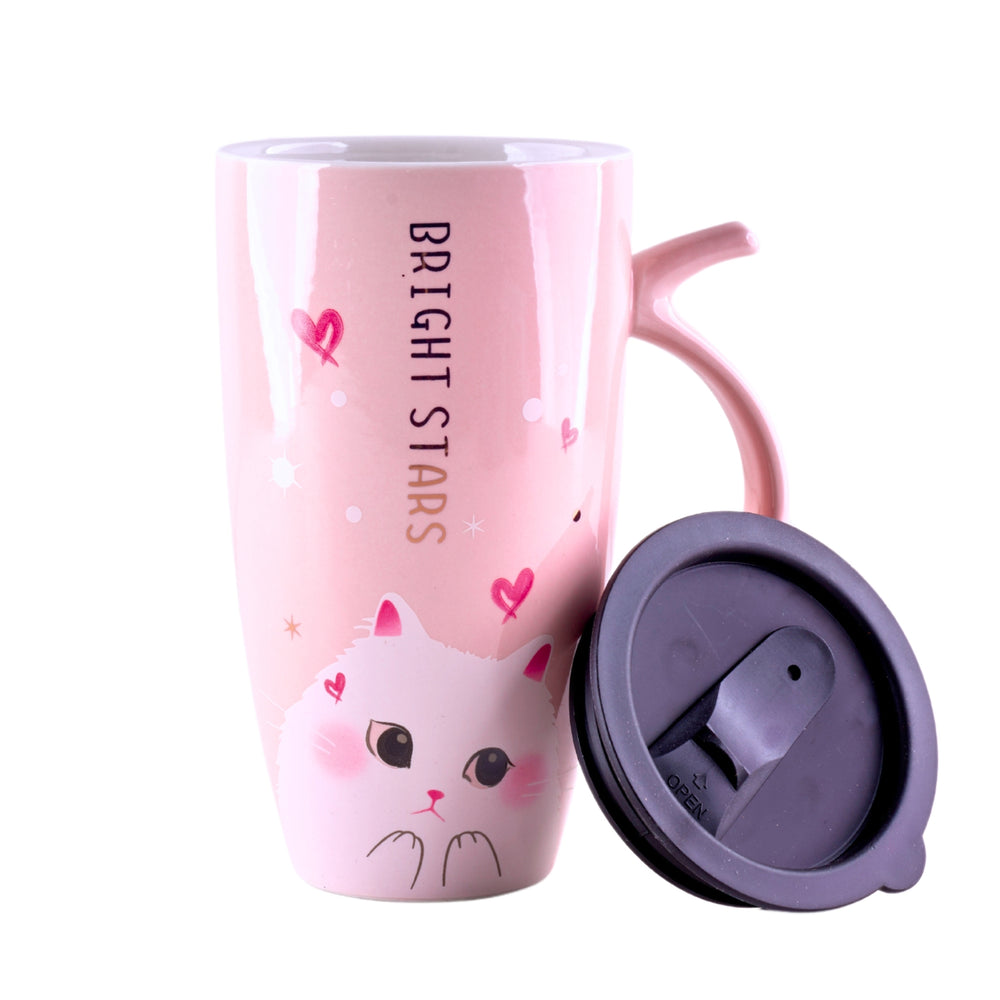 a tall pink ceramic mug with a leakproof silicone lid and cute cat print and bright stars written on it.
