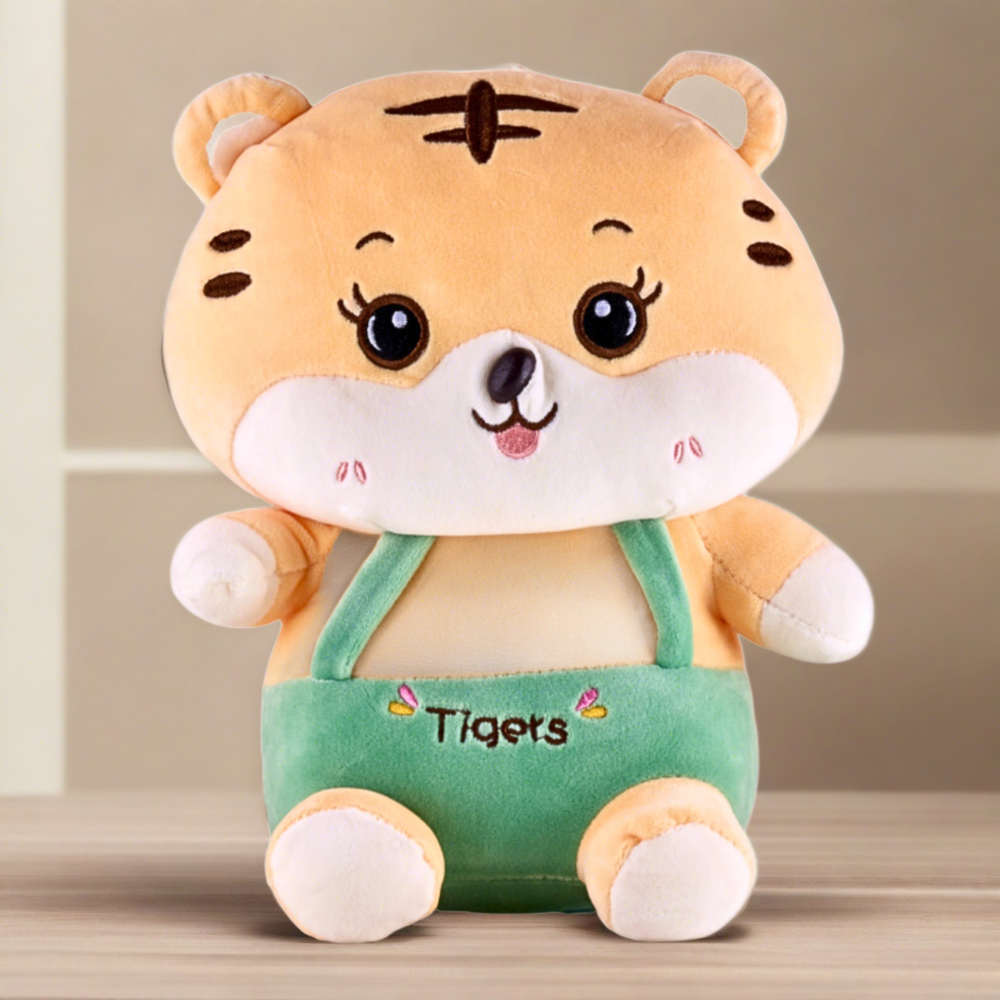 A orange and black striped plush tiger toy sitting on a white background. The tiger has a friendly smile and stitched eyes.