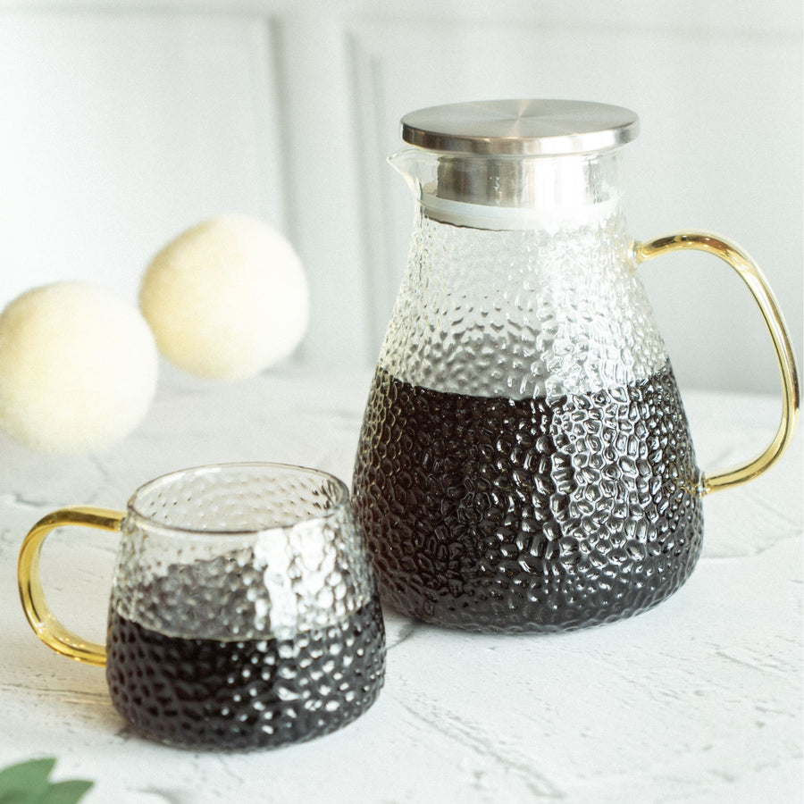 Textured glass pitcher with lid. Perfect for iced tea, coffee, lemonade, or any beverage.