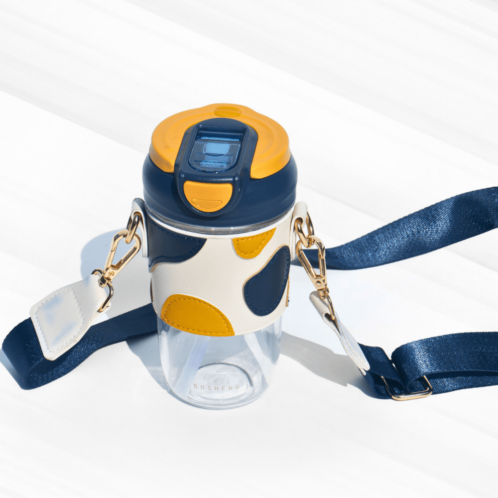 Travel Sipper with Leatherette Sleeve And a Strap Sipper