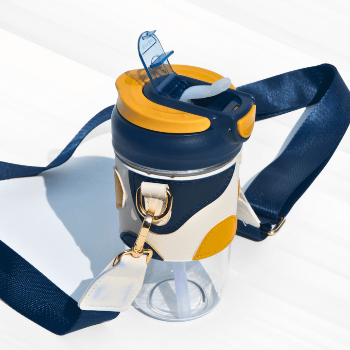 Travel Sipper with Leatherette Sleeve And a Strap Sipper