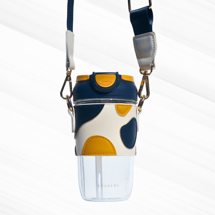 Travel Sipper with Leatherette Sleeve And a Strap Sipper