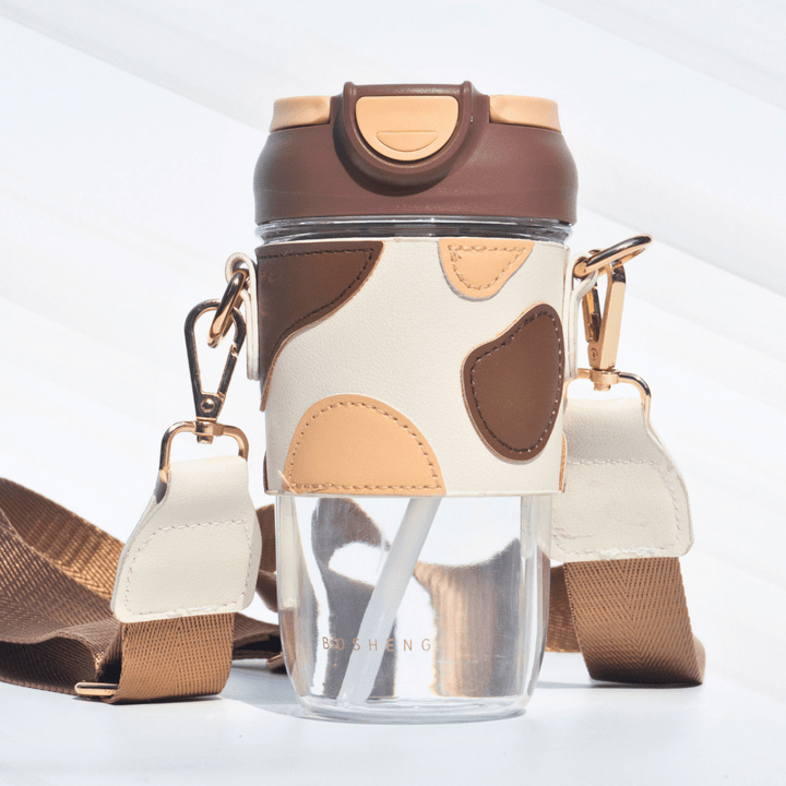 Travel Sipper with Leatherette Sleeve And a Strap Sipper