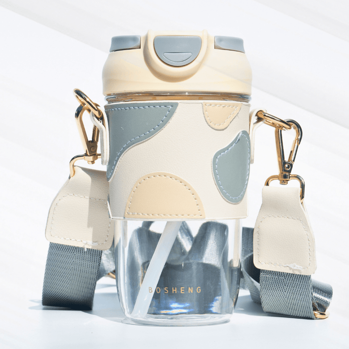 Travel Sipper with Leatherette Sleeve And a Strap Sipper