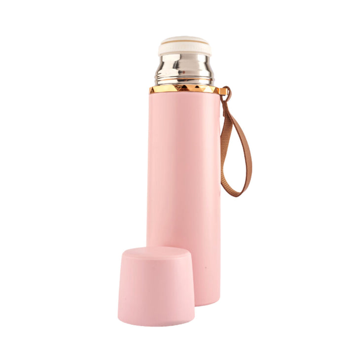 Refillable stainless steel insulated bottle with a leakproof lid and a leather strap for easy carrying. Perfect for travel. 500ml capacity. Available in pastel colors. Pink.