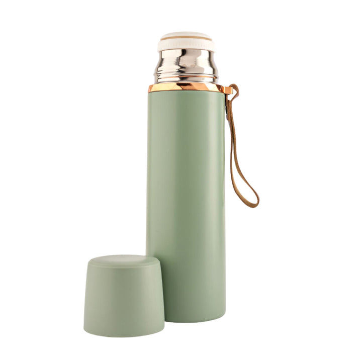 Refillable stainless steel insulated bottle with a leakproof lid and a leather strap for easy carrying. Perfect for travel. 500ml capacity. Available in pastel colors. Mint Green.